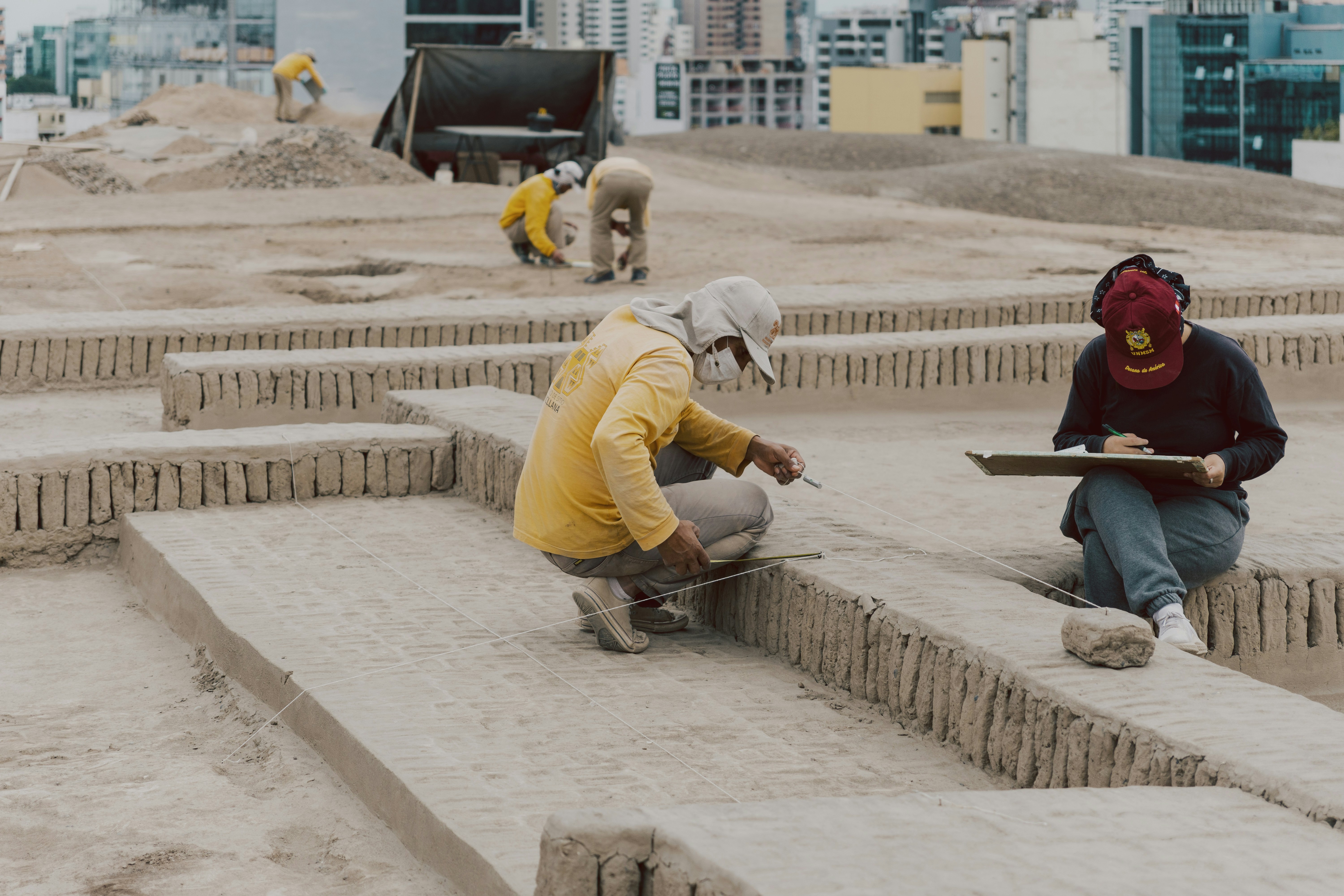 A construction worker assisting with bricklaying